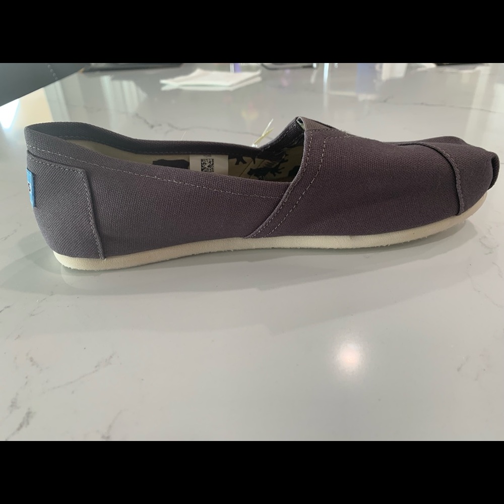 NWT no box.  Tom’s canvas slip-on shoes.  Gray/Women’s 10.  $25